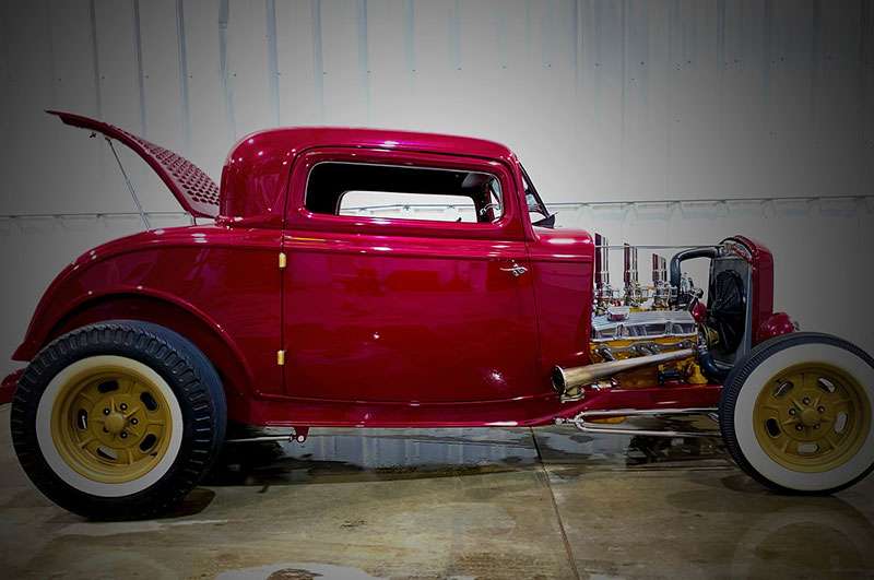 red 1932 ford coupe with the trunk open