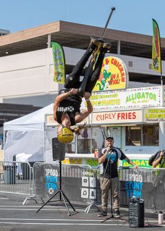 pogo stunt team member performing aerial trick for crowd